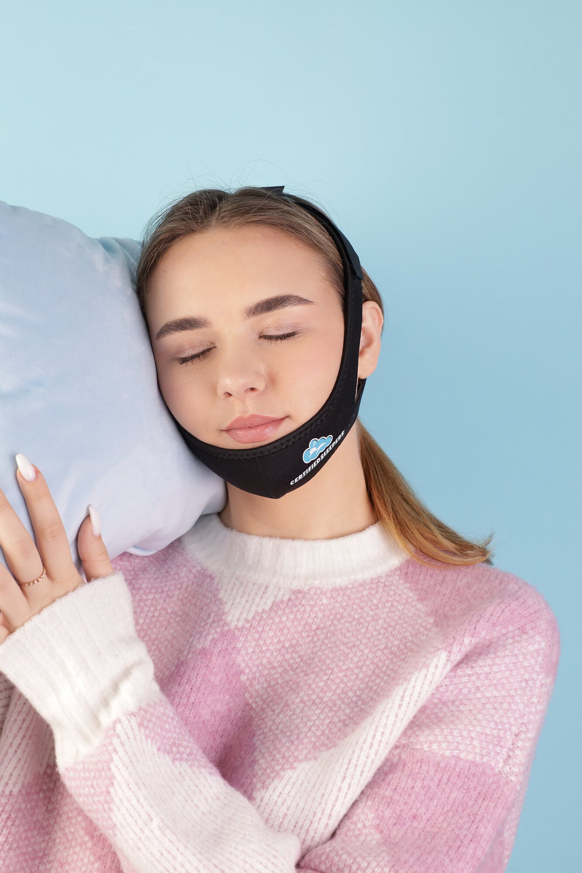 Model resting with Certified Sleepers adjustable chin strap