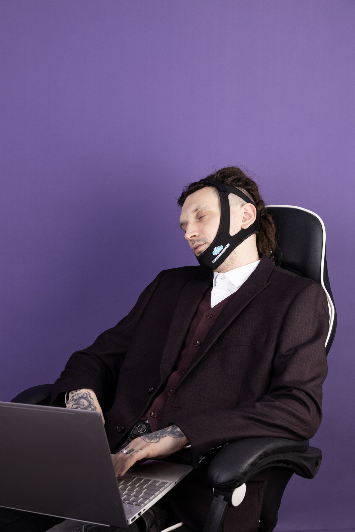 Man using the Certified Sleepers chin strap during a simple evening routine